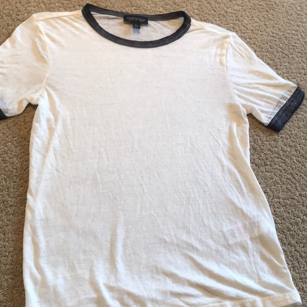 Classic cream tee with grey collar.